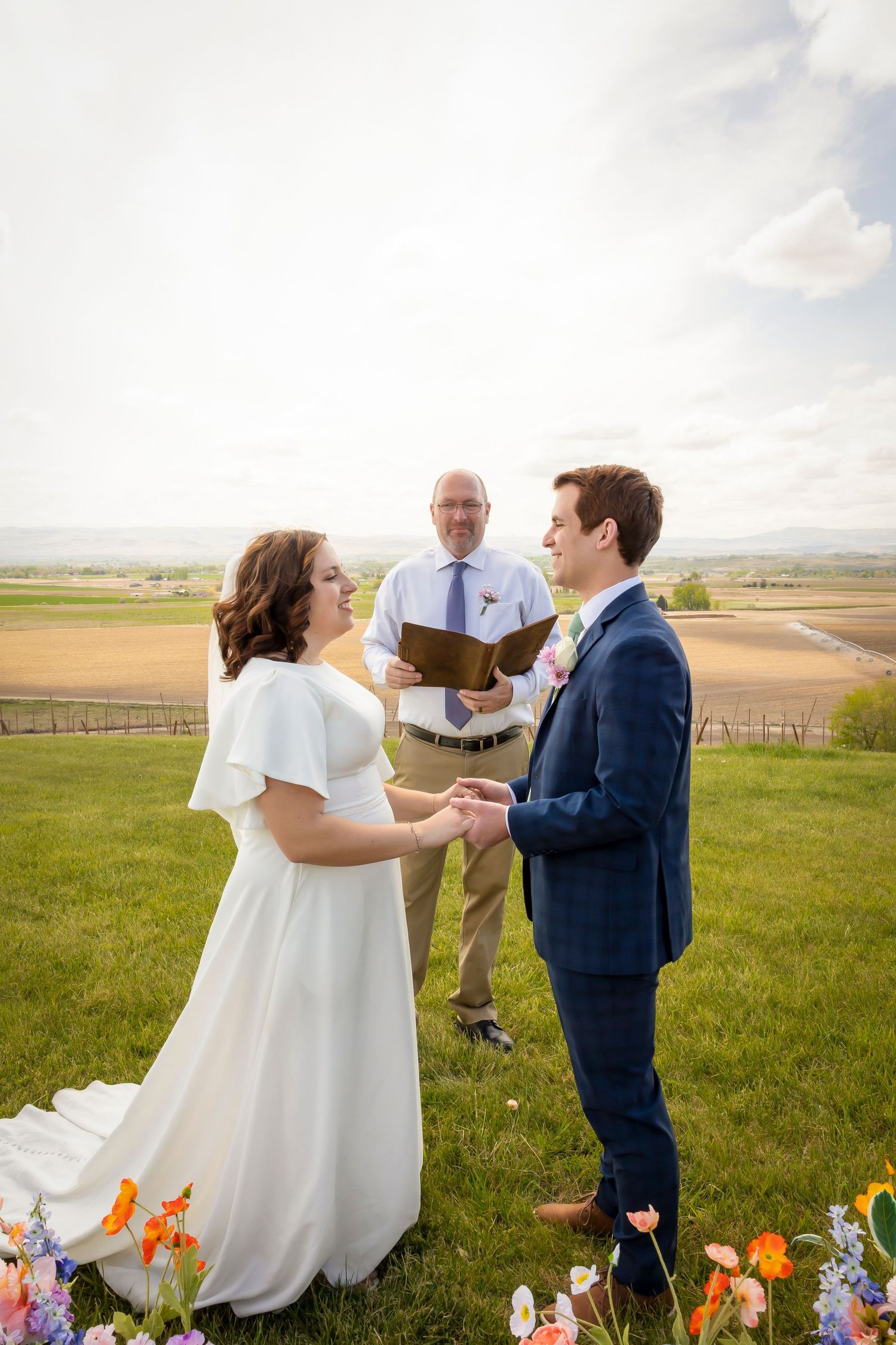officiant with bride and groom