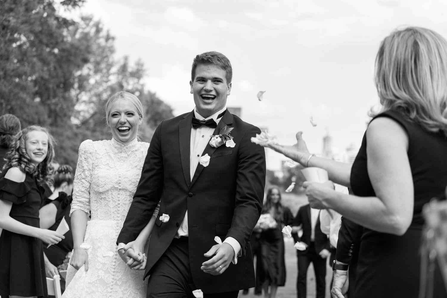 Black and white capture of joyful moment during outdoor nashville wedding ceremony.