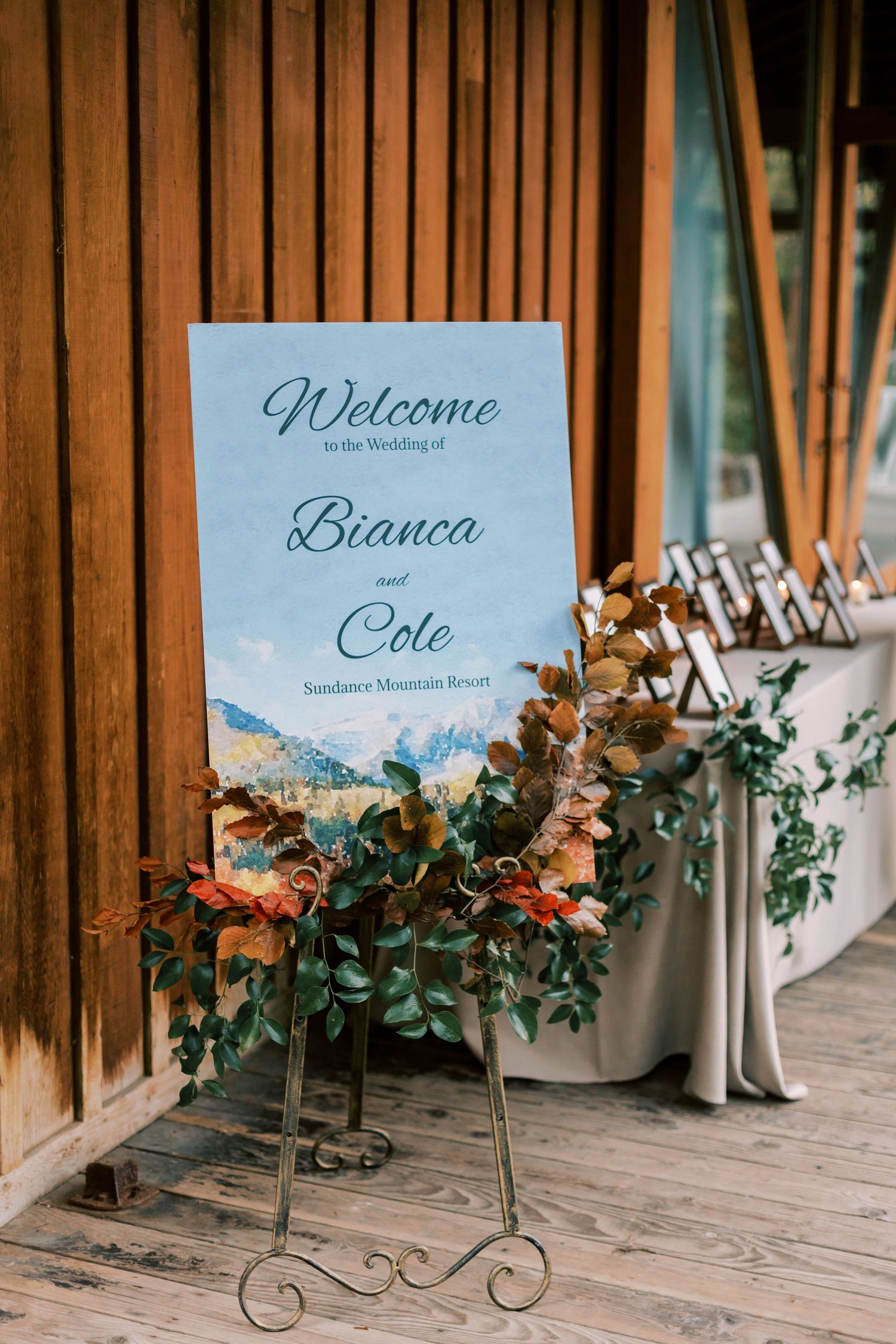 Wedding welcome sign with floral decorations at Sundance Mountain Resort.