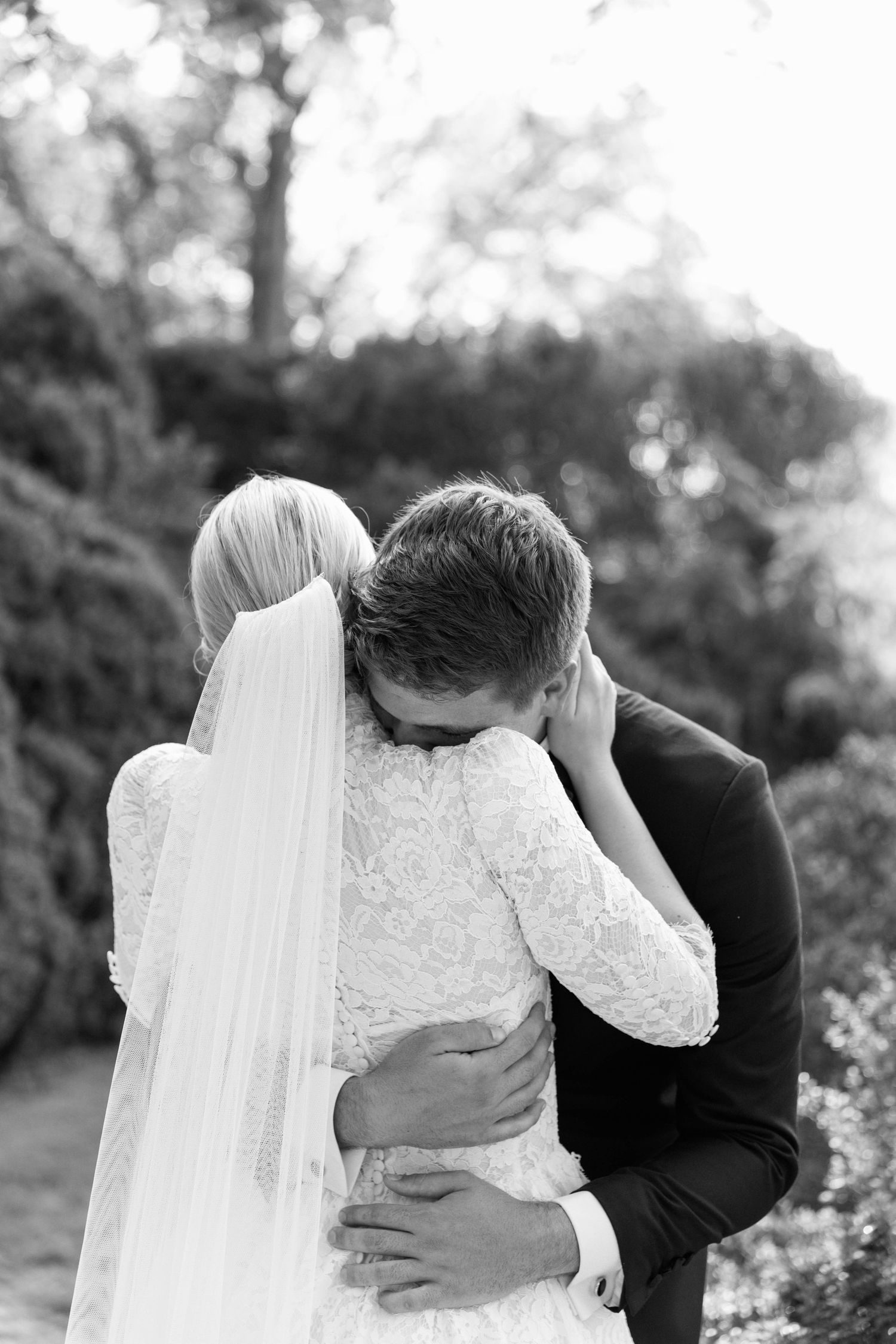 An intimate black and white moment between newlyweds in a garden setting at Cheekwood Garden Estate.