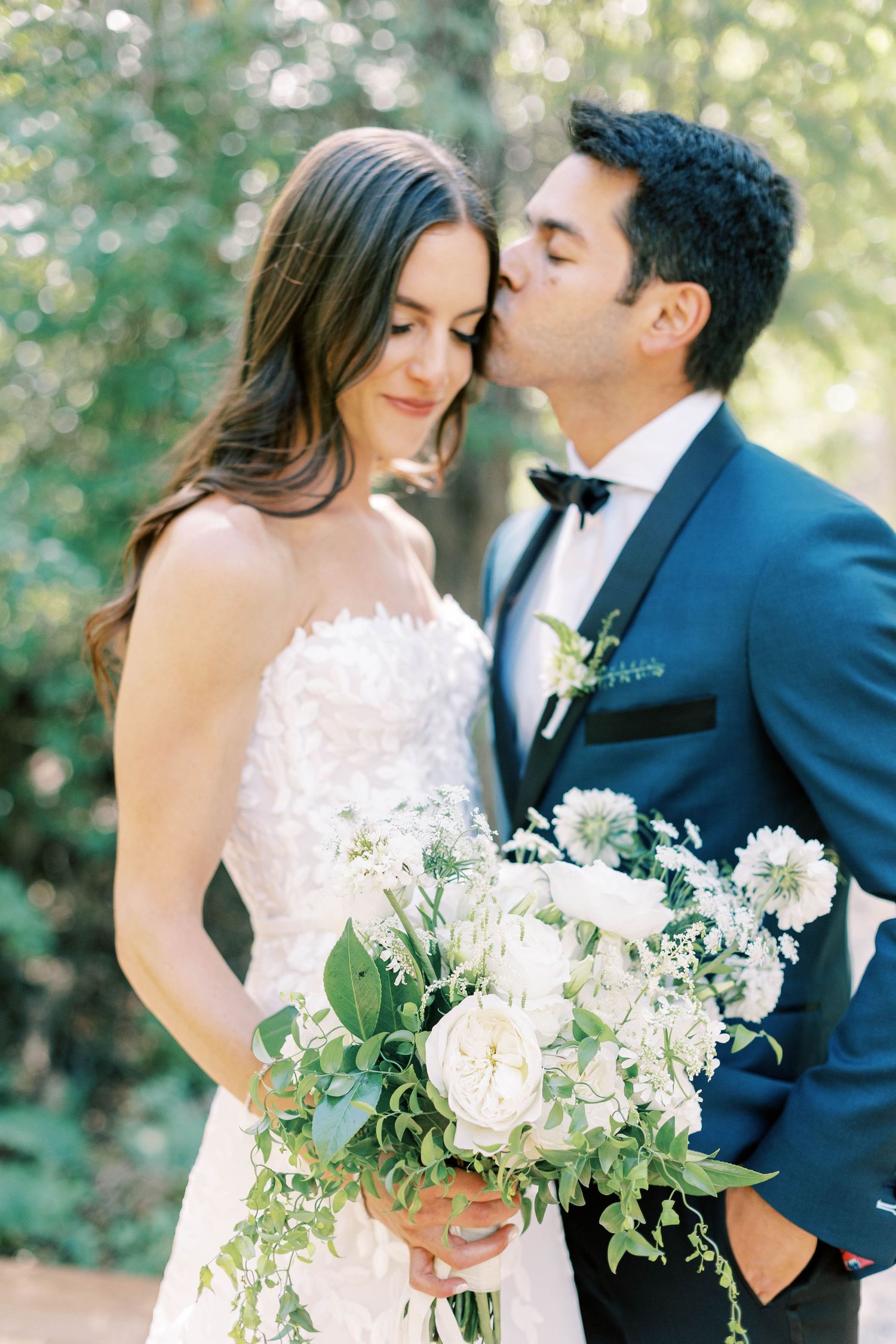 Intimate moment between bride and groom during outdoor wedding at blue sky ranch.
