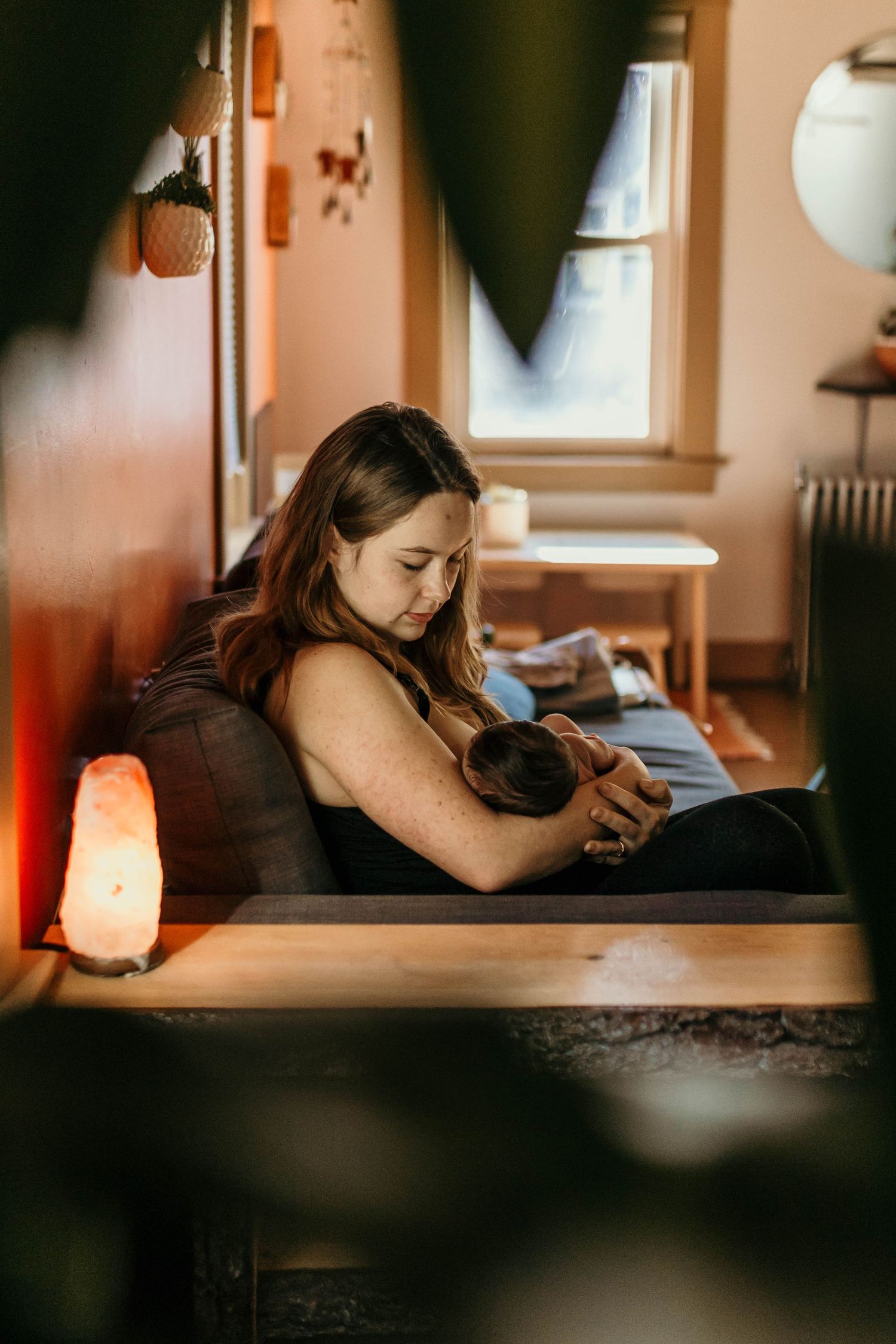 Cozy indoor scene with warm lighting and salt lamp in a peaceful room setting.