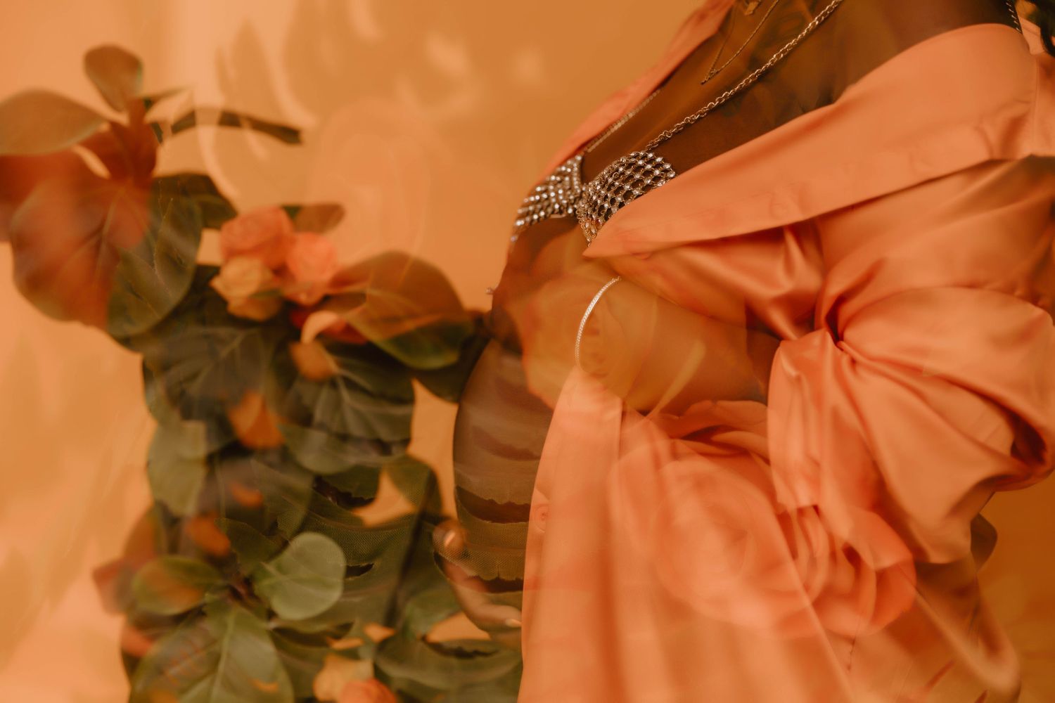 Soft peach-colored formal dress with accessories and floral decorations in warm lighting.