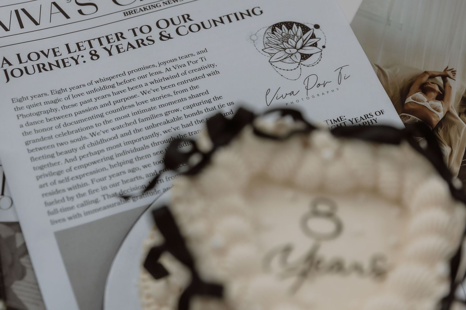 A close-up view of a vintage-style letter with text '8 years' and decorative elements in soft focus.