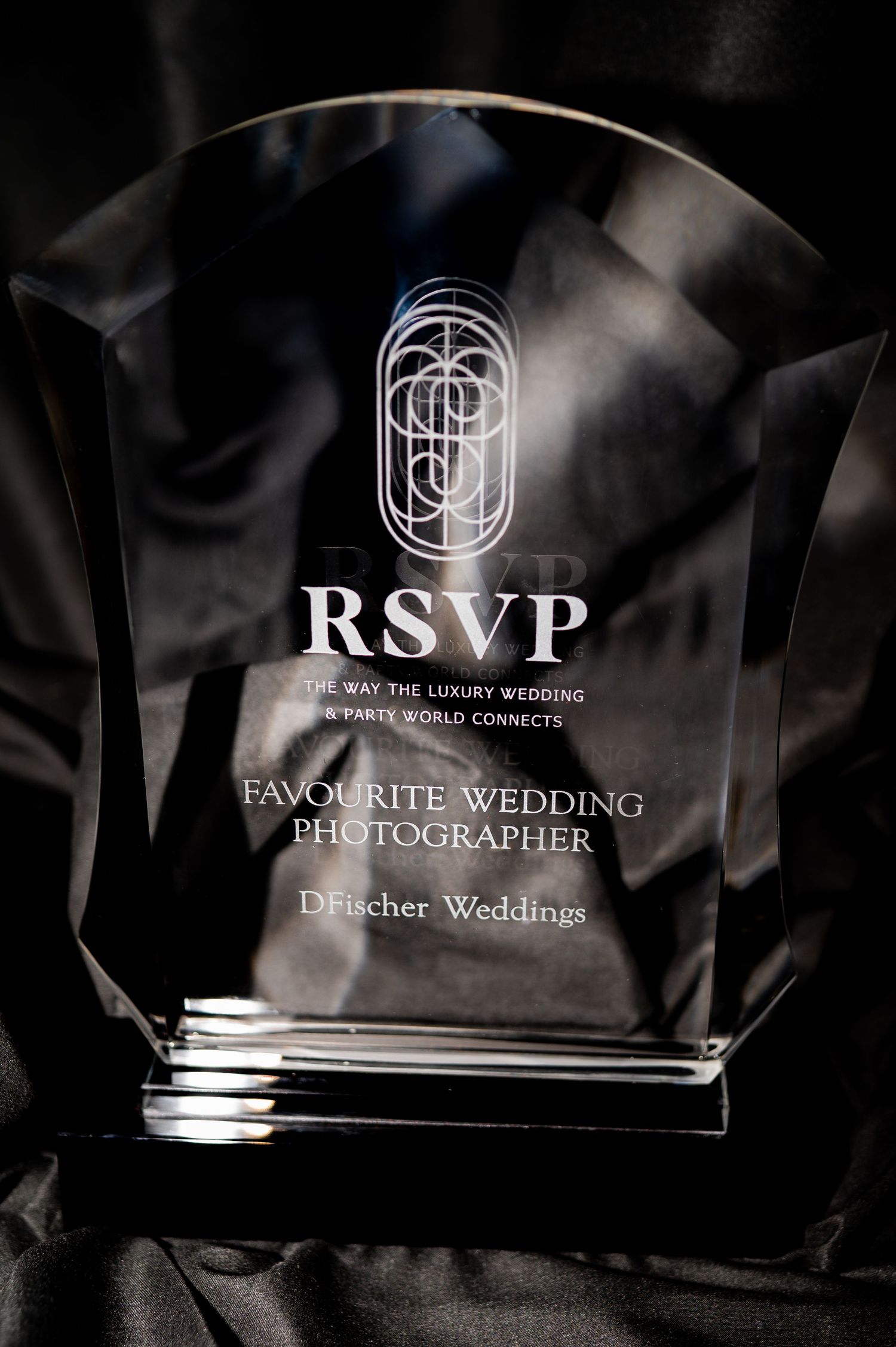 Clear glass or acrylic RSVP award trophy for Favorite Wedding Photographer by Deutscher Weddings with palm tree logo.