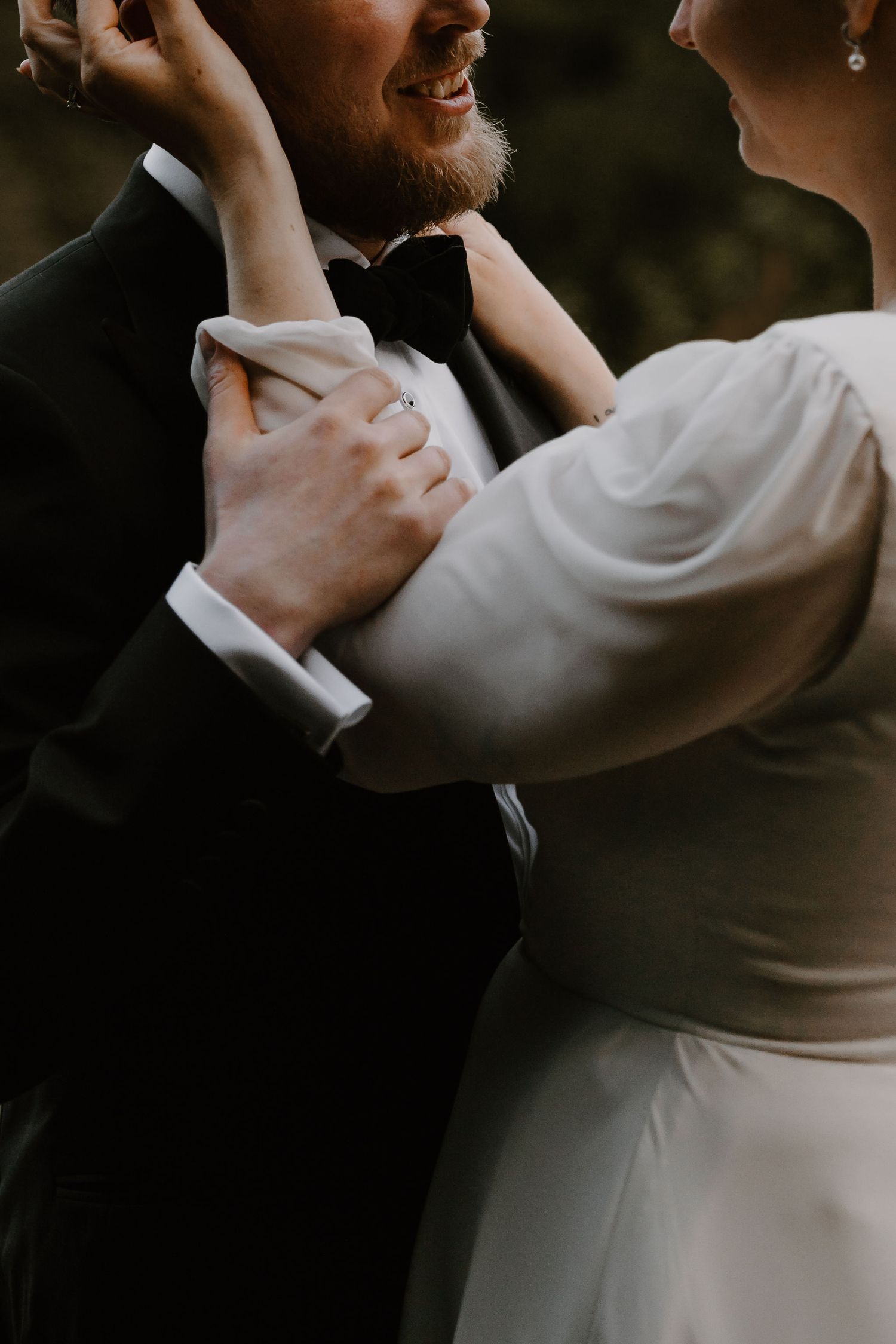 Close-up of a couple dancing together in a romantic embrace, with soft lighting creating an intimate mood.