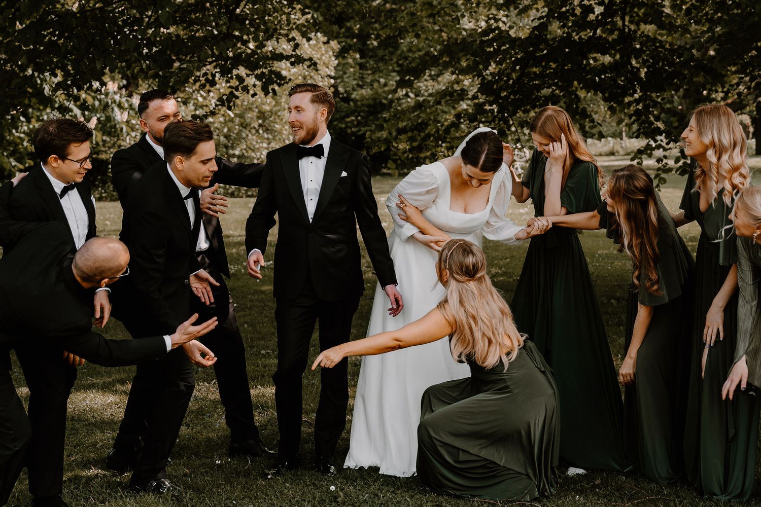 A collection of candid wedding party moments shows celebrations and embraces in an outdoor garden setting.