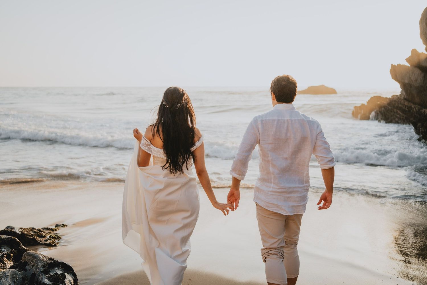 Wandersoul Stories Elopements and Destination Weddings Portugal - Wedding at the beach - couple walking near the water