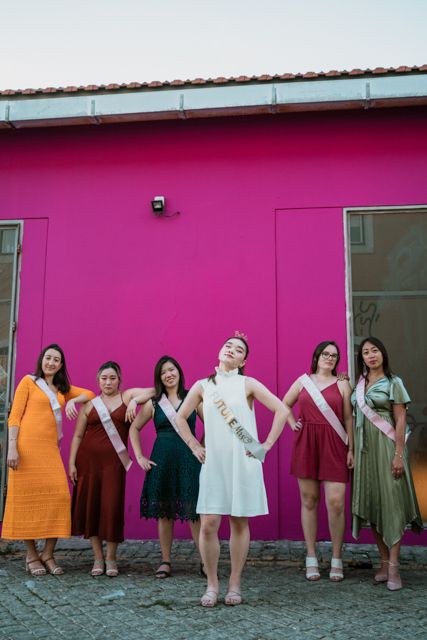 Wandersoul Stories Bachelorette Party Photos - bride with friends in lisbon pink wall