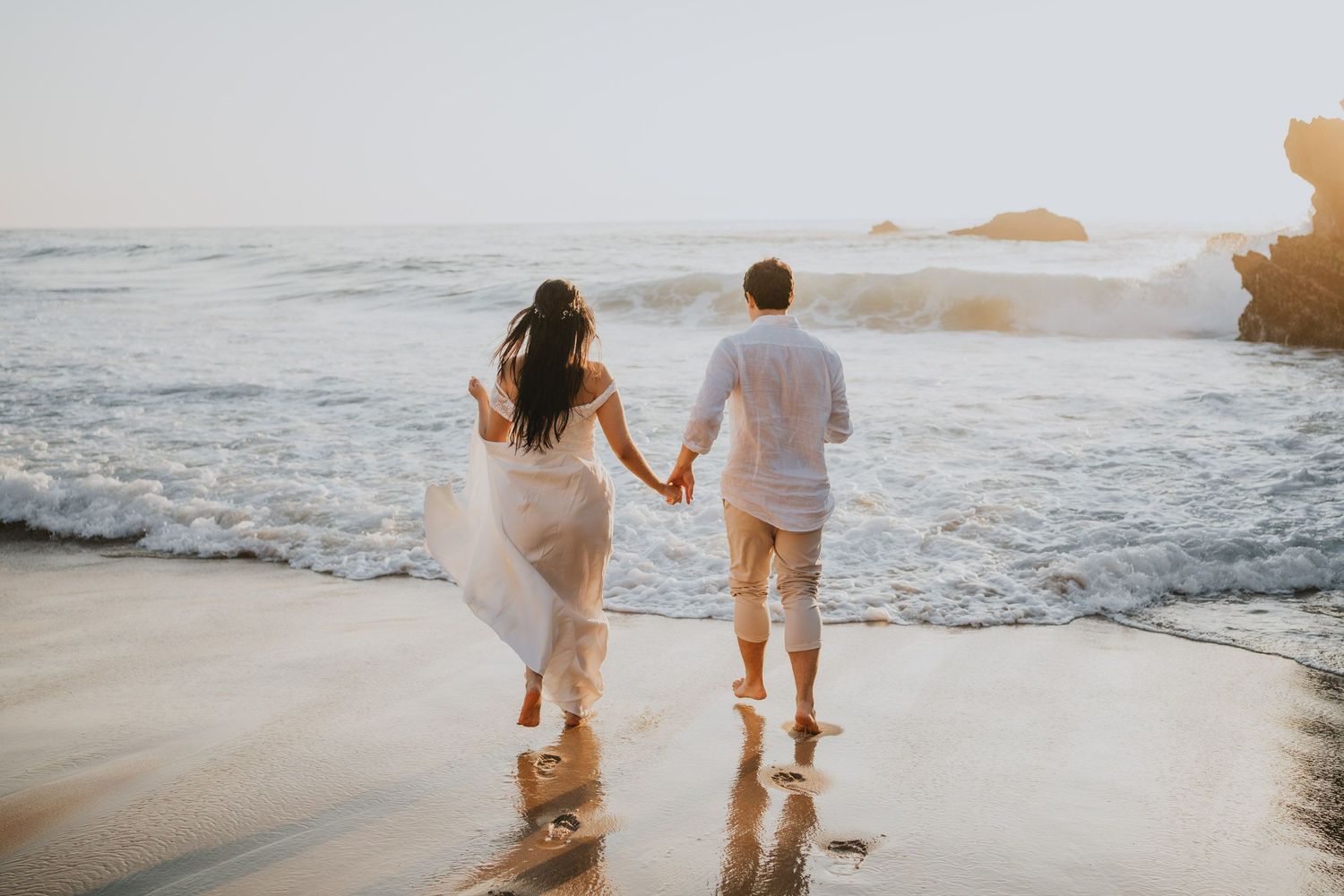 Wandersoul Stories Elopements and Destination Weddings Portugal - Wedding at the beach - couple walking to the water