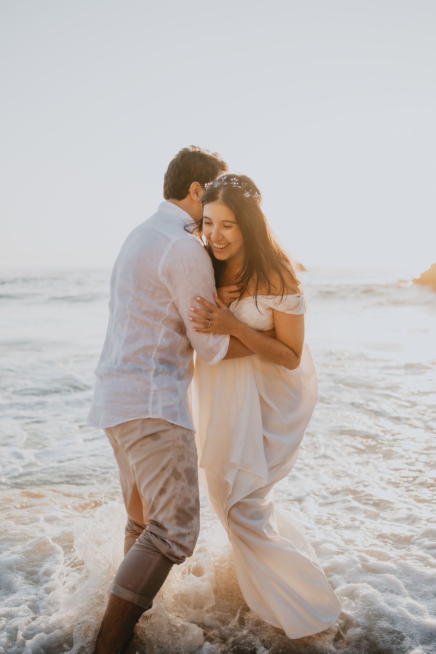 Wandersoul Stories Elopements and Destination Weddings Portugal - Wedding at the beach - couple hugging in the water