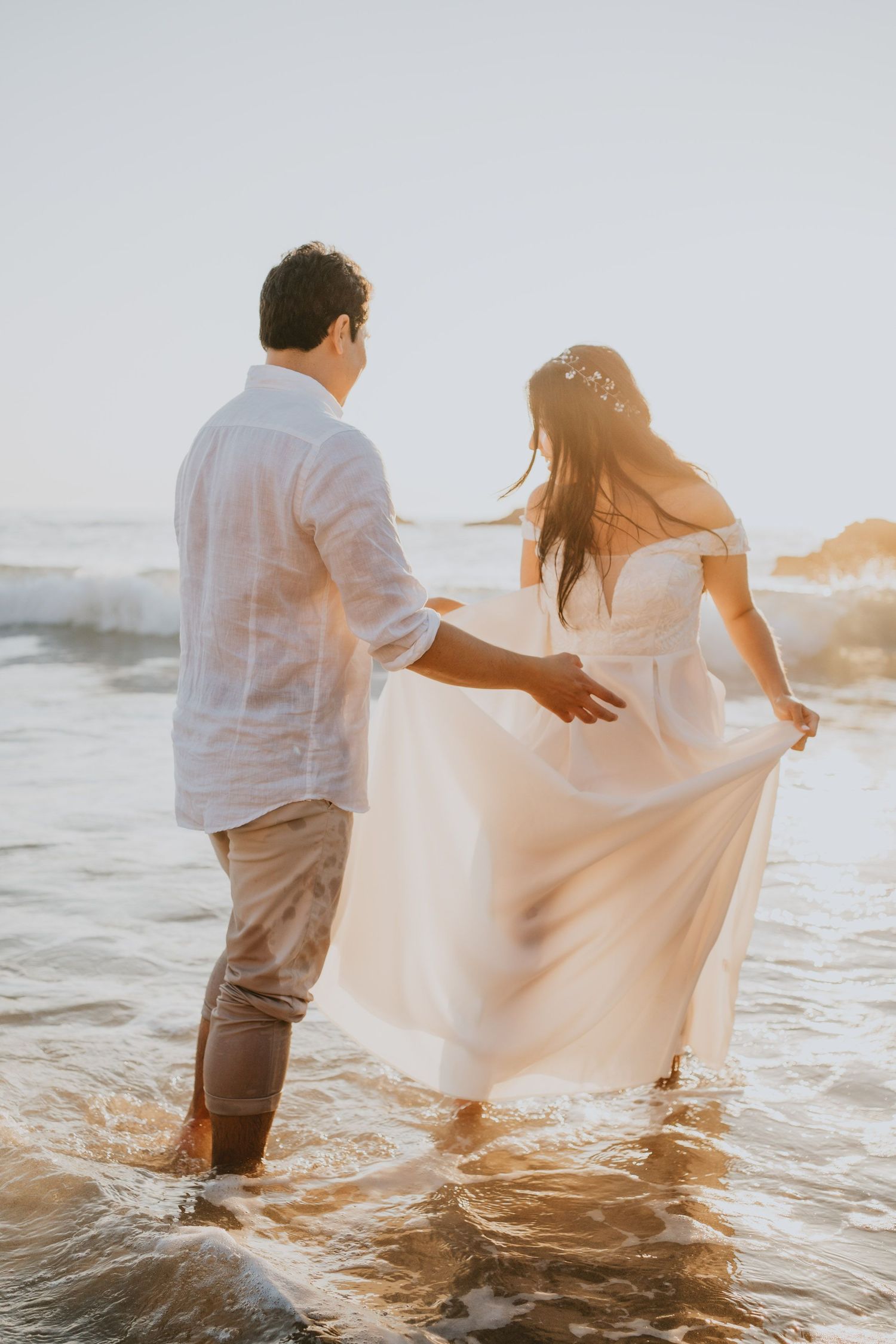Wandersoul Stories Elopements and Destination Weddings Portugal - Wedding at the beach - sunset in the water