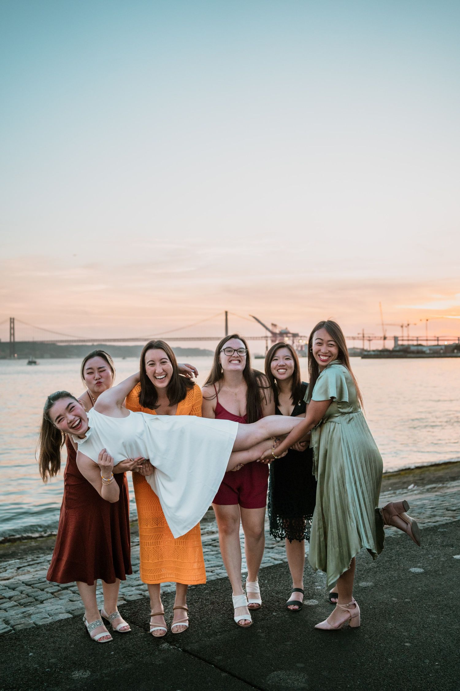 Wandersoul Stories Bachelorette Party Photos - bride with friends in lisbon near the river