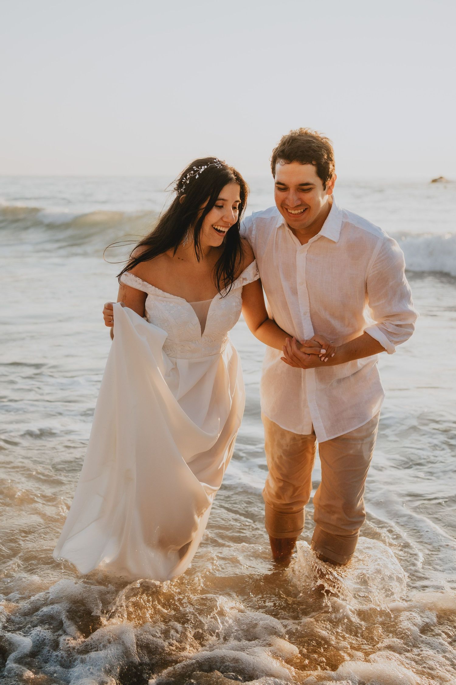 Wandersoul Stories Elopements and Destination Weddings Portugal - Wedding at the beach - couple laughing in the water