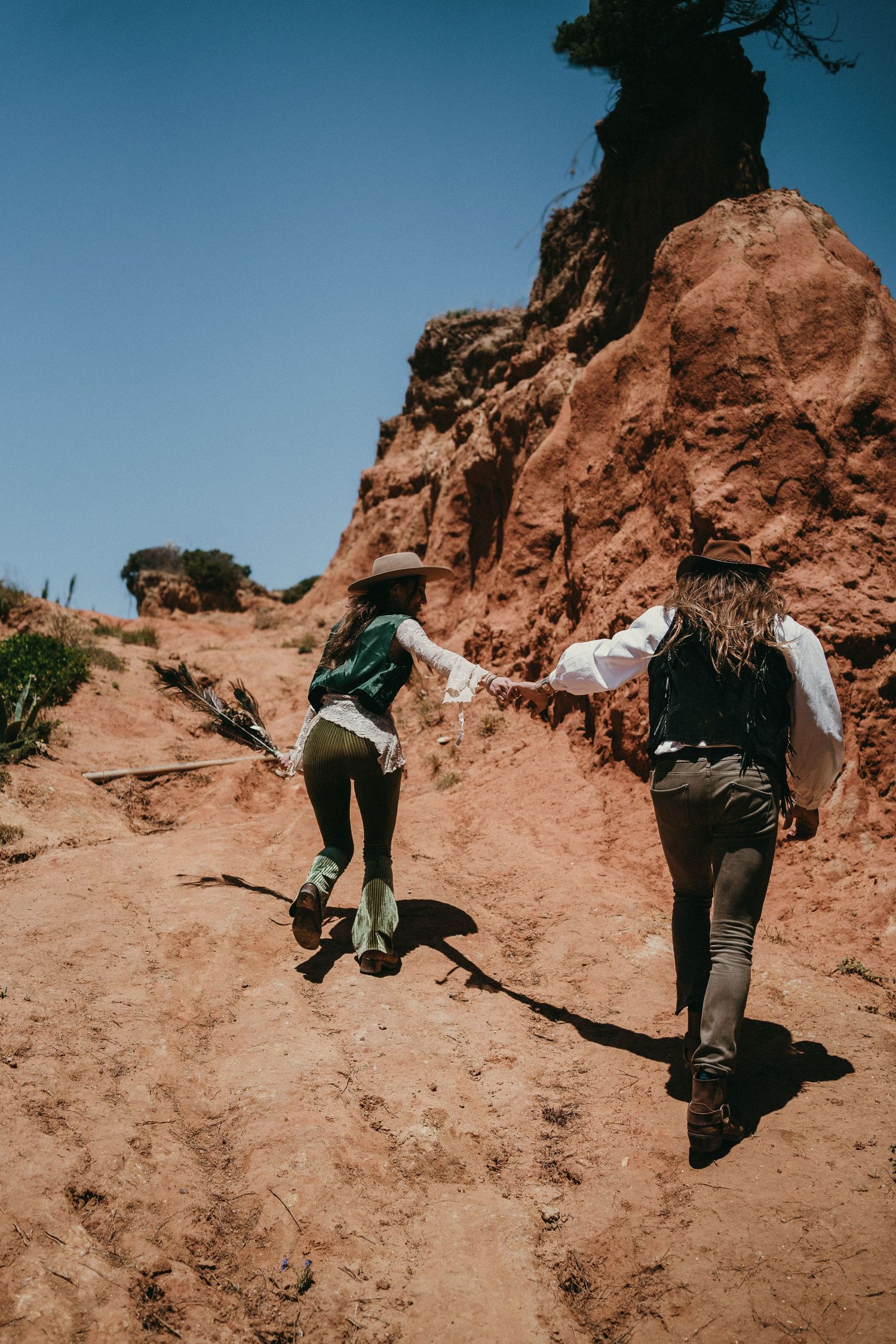 Wandersoul Stories Elopements and Destination Weddings Portugal - Wedding desert - couple climbing