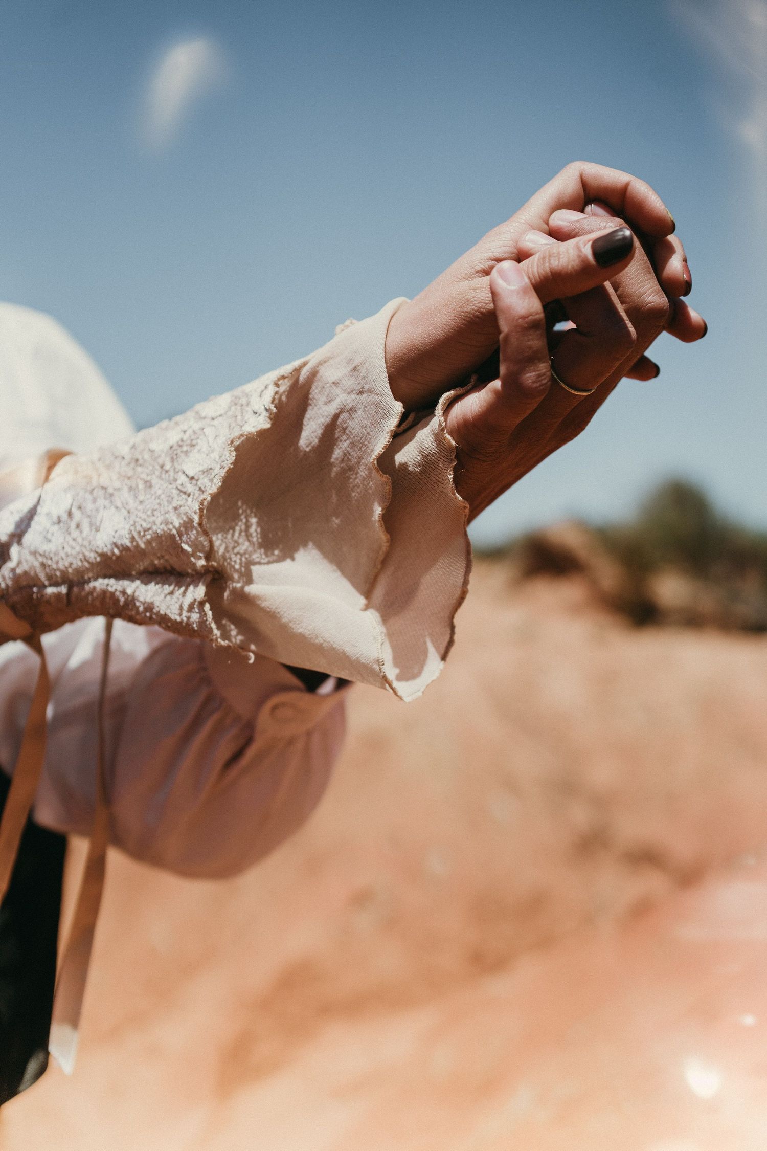 Wandersoul Stories Elopements and Destination Weddings Portugal - Wedding in the desert - couple holding hands
