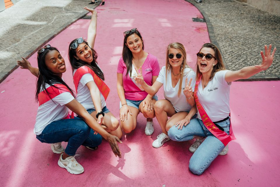 Wandersoul Stories Bachelorette Party Photos - bride with friends in lisbon in pink street