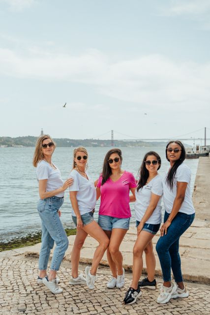 Wandersoul Stories Bachelorette Party Photos - bride with friends in lisbon near the river