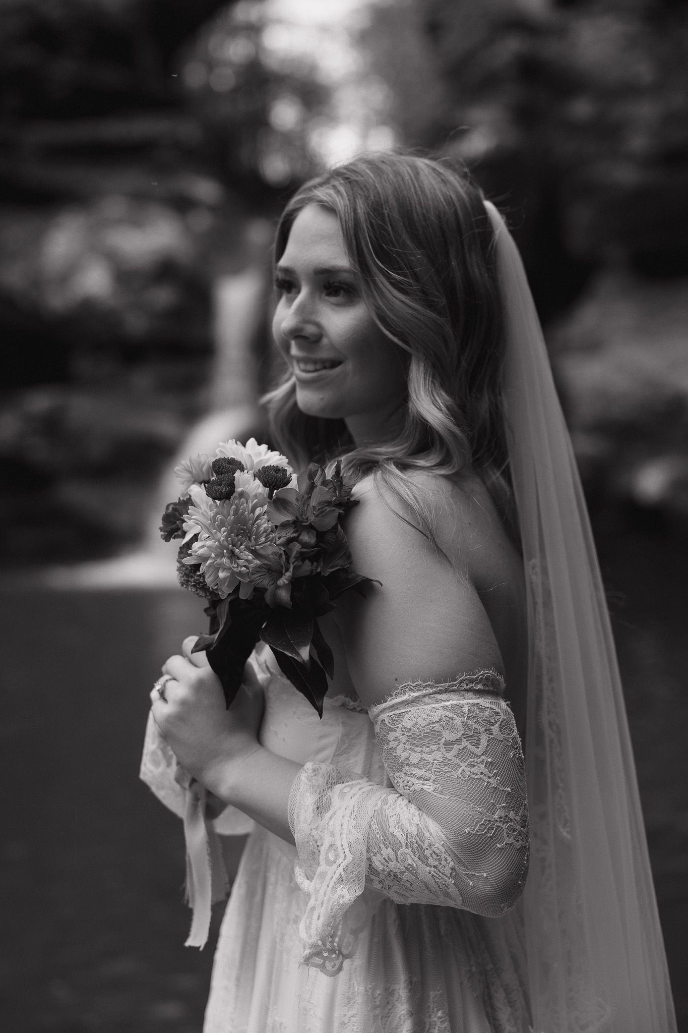 Bridal portrait of a smiling bride holding her bouquet during an intimate elopement in New York.