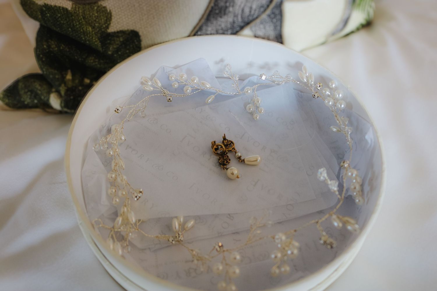 A sequence of translucent bowls containing tiny floating objects demonstrating the progression of sediment settling over time.