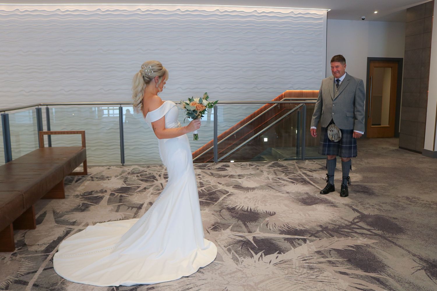 A panoramic view of five tender first look moments captured in a modern indoor wedding venue with neutral decor.