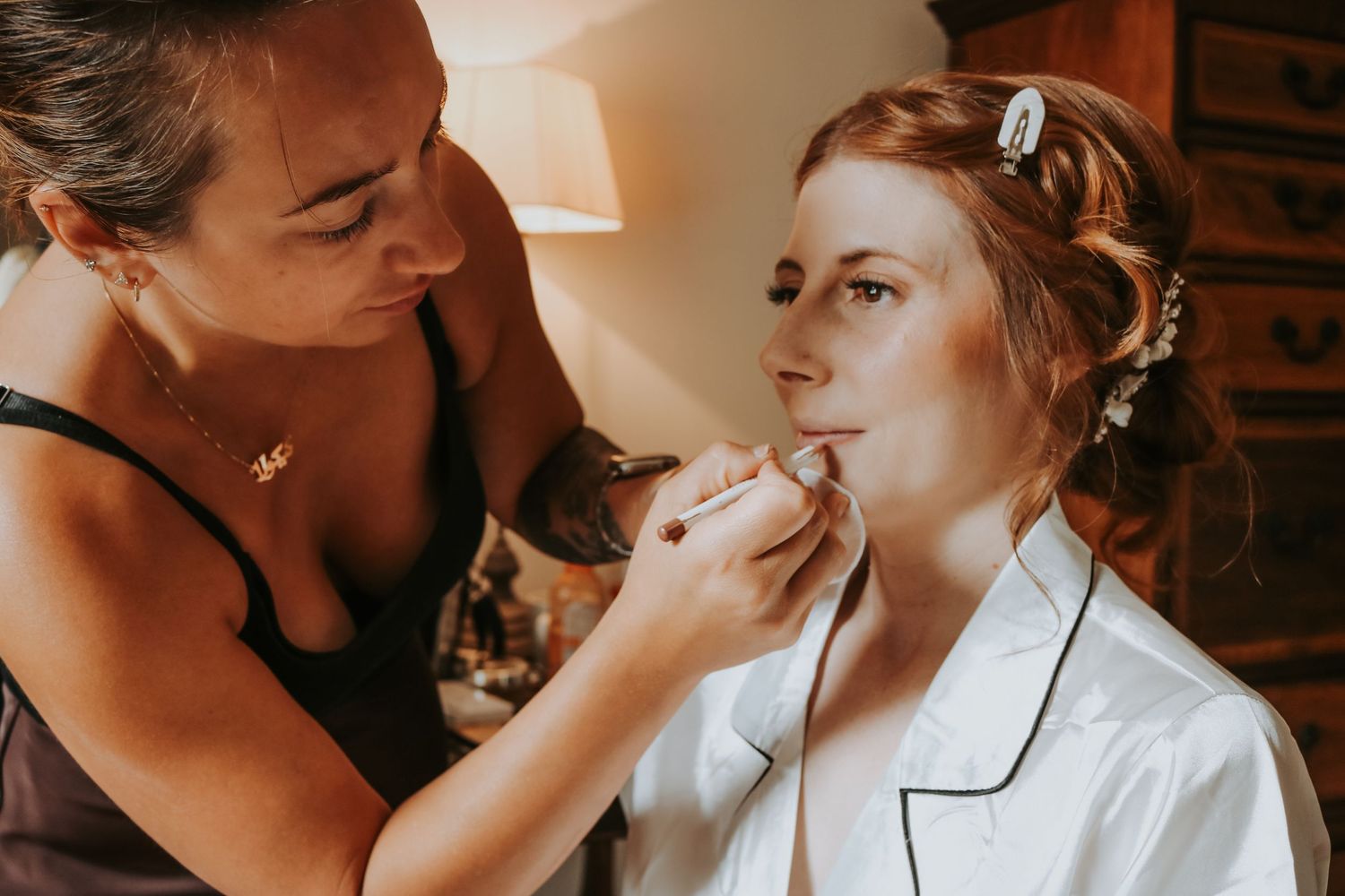 A series of romantic wedding photos showing tender moments between a couple in a rustic indoor setting.