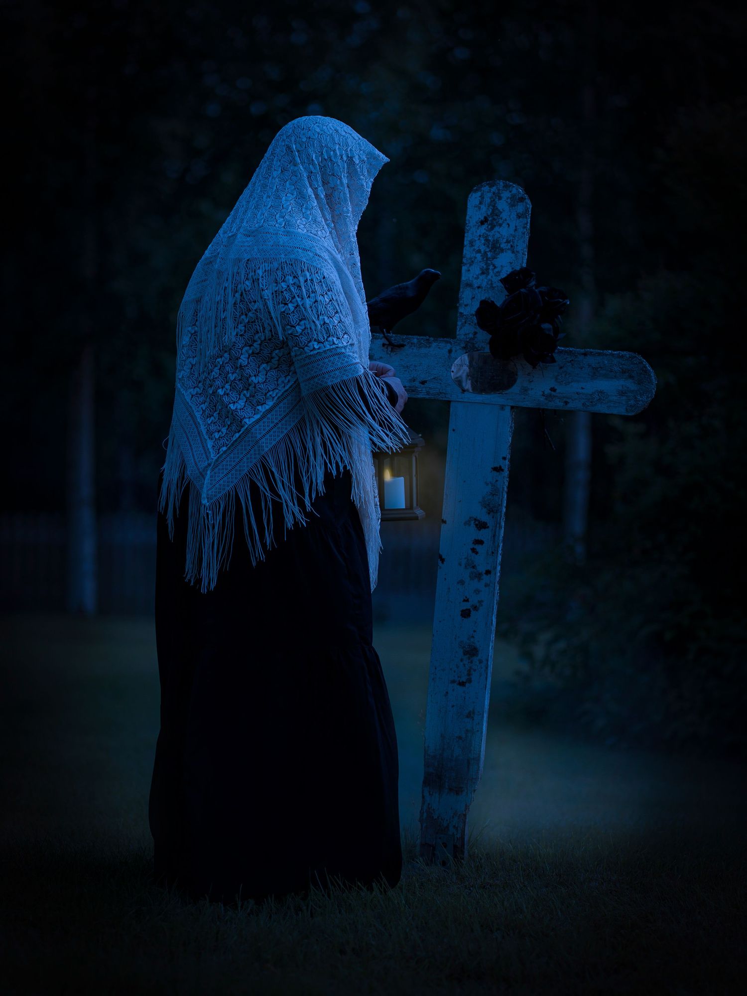 A ghostly figure in white lace shawl stands solemnly next to cemetery headstones in a dark, moody atmosphere.