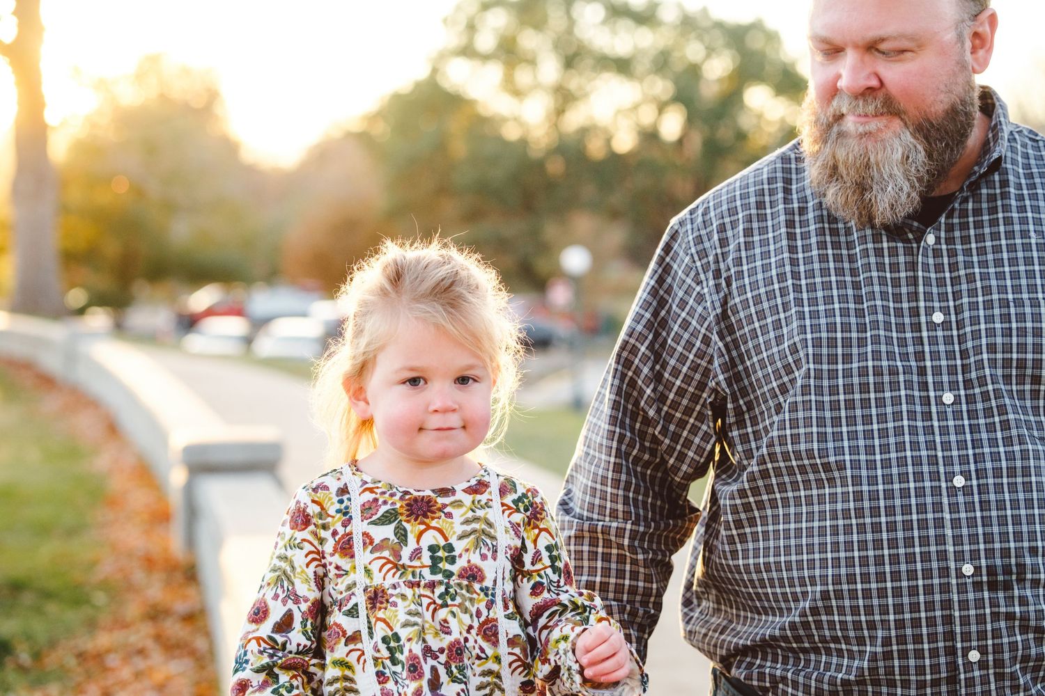 Father walking with toddler girl at City Park.