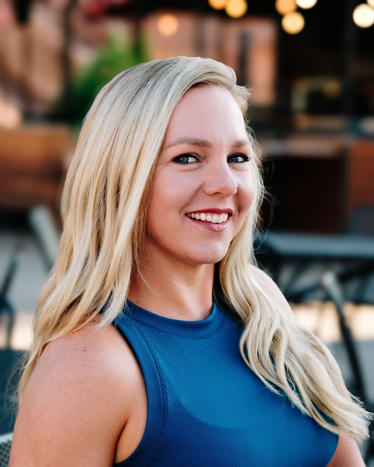 Headshot fitness trainer, Paige, of Progress with Paige based in Lakewood, Colorado.