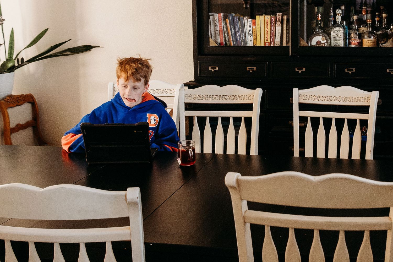 Denver photographer project 365 - boy doing homework at table