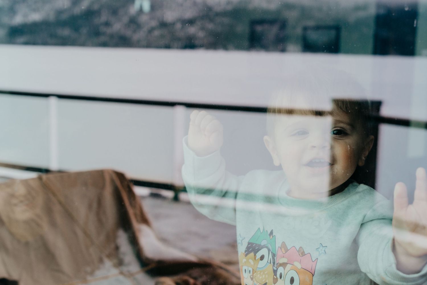 Denver photographer project 365 - through the window shot of toddler boy smiling