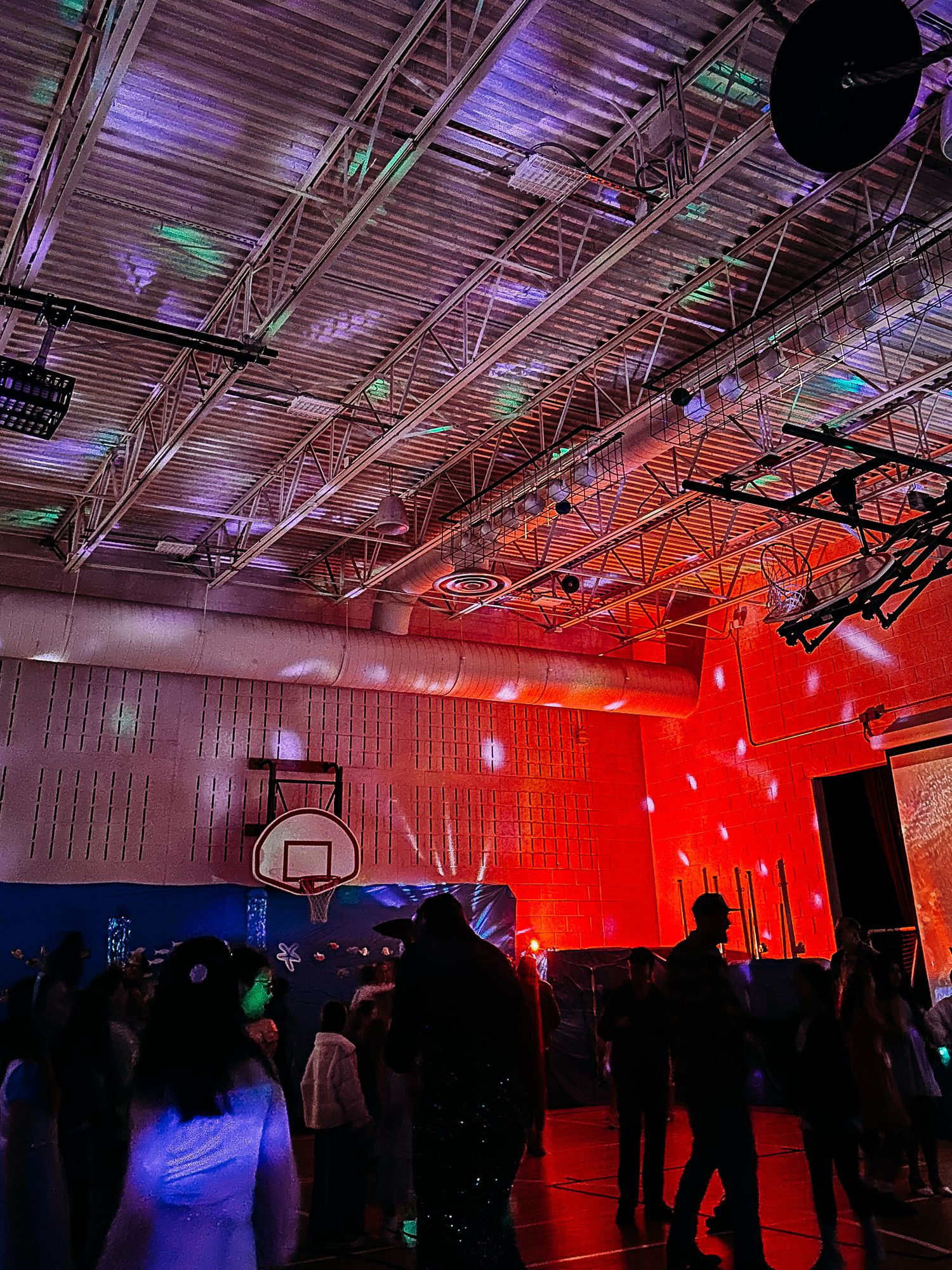 Colorful ceiling of elementary school gym at school dance.