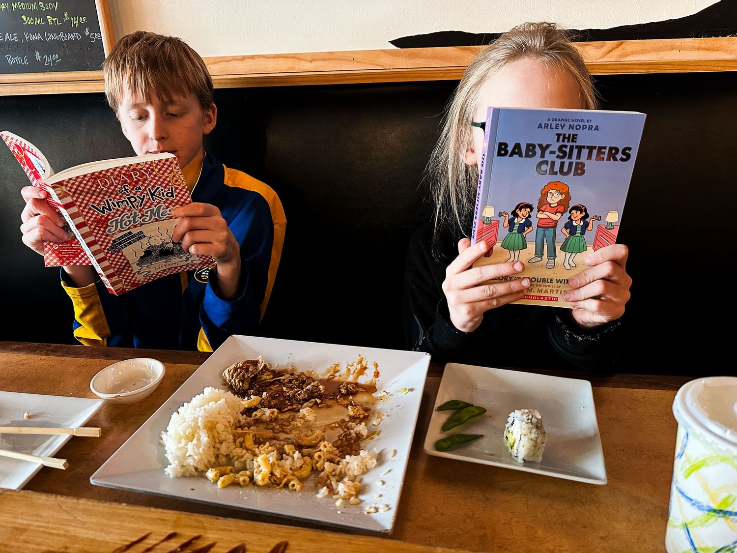 Denver photographer project 365 - kids reading books at sushi restaurant