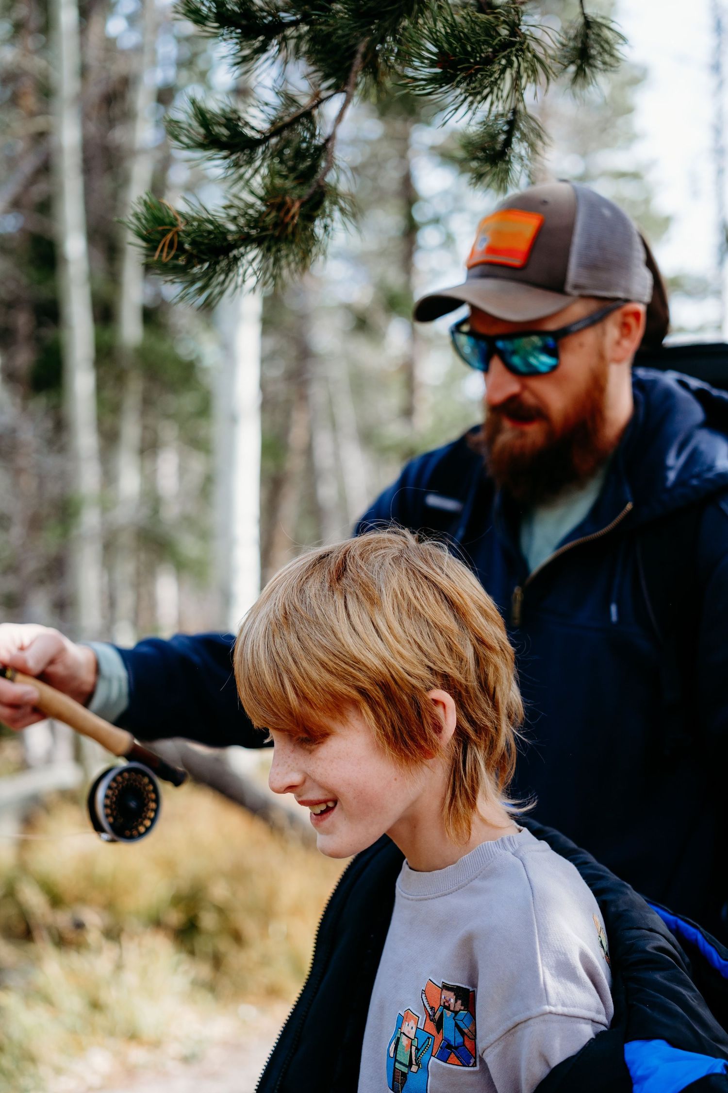 Father and son fishing in Rocky Mountain National Park.