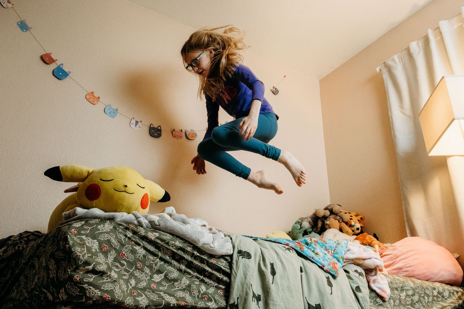 Denver photographer project 365 - child jumping on bed, pikachu stuffy on bed