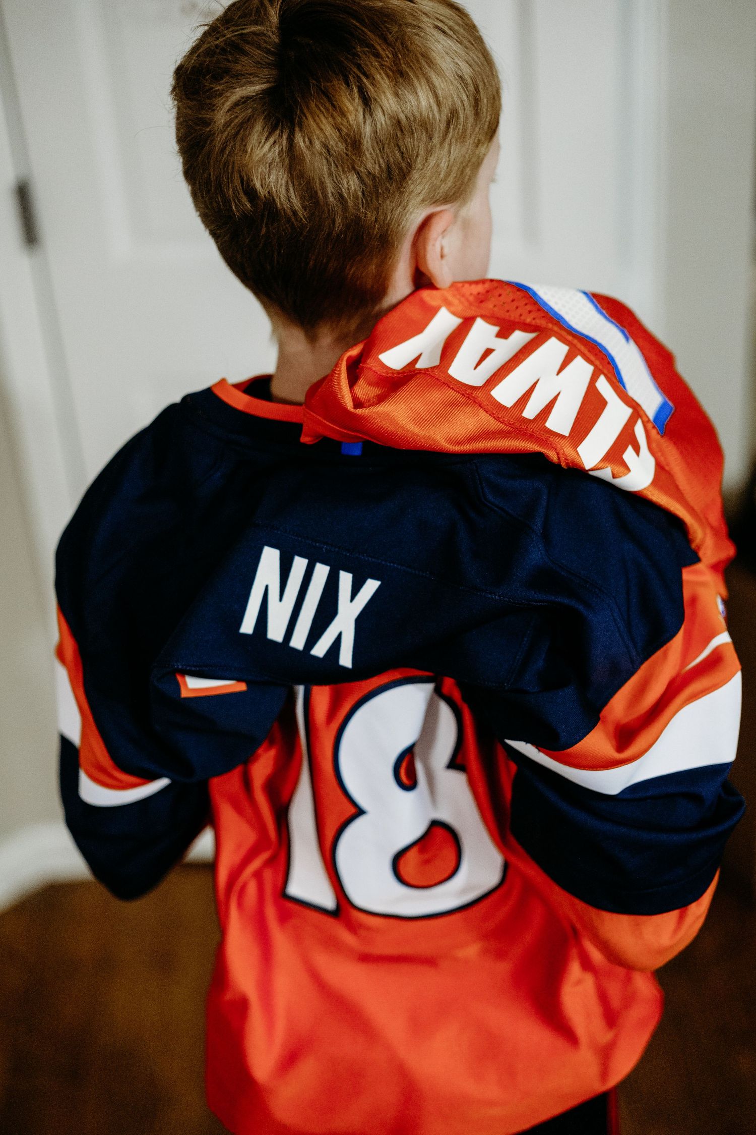 Denver photographer project 365 young boy sporting three broncos jerseys at one time