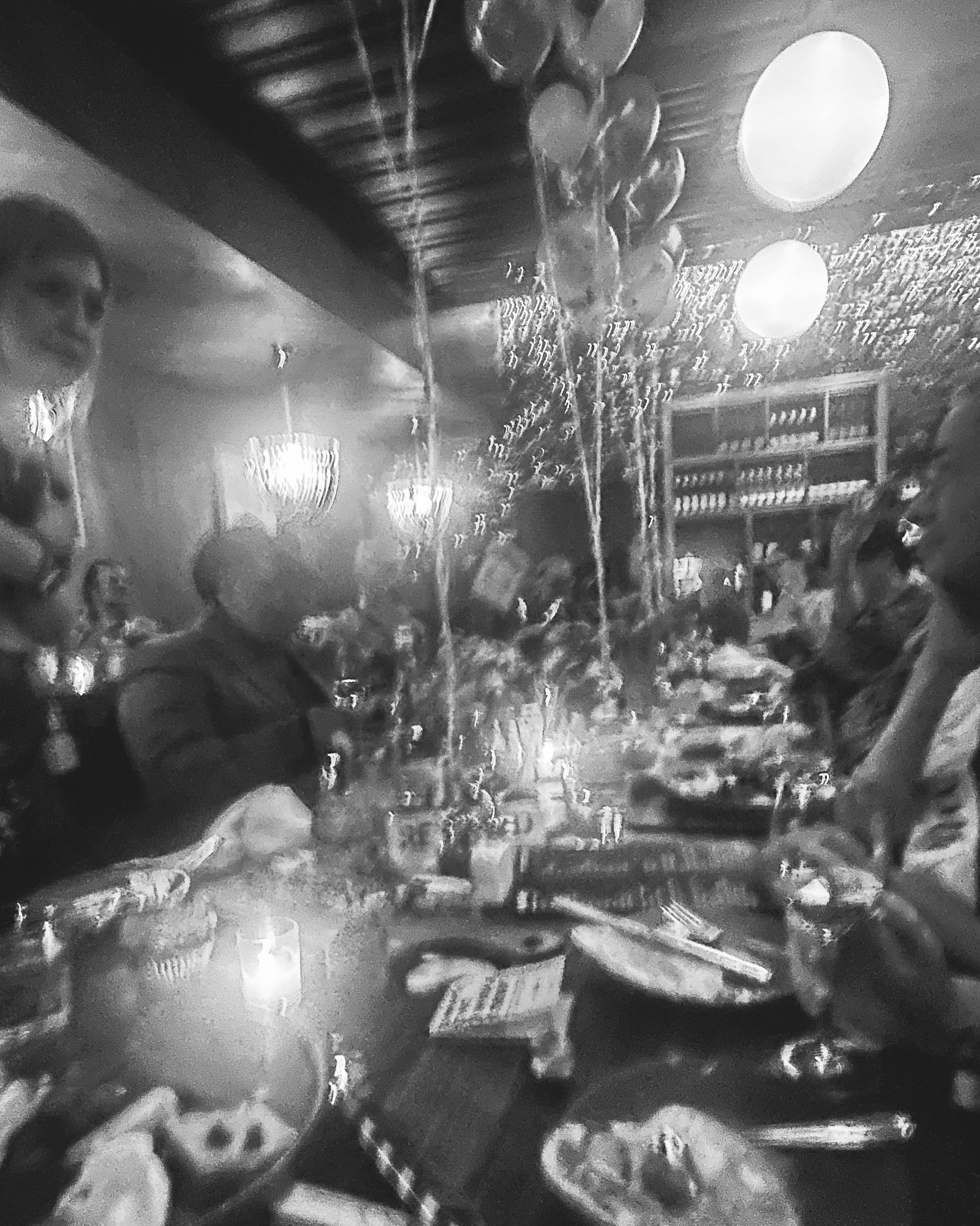 Denver photographer project 365 black and white blurry photo of engagement party at restaurant