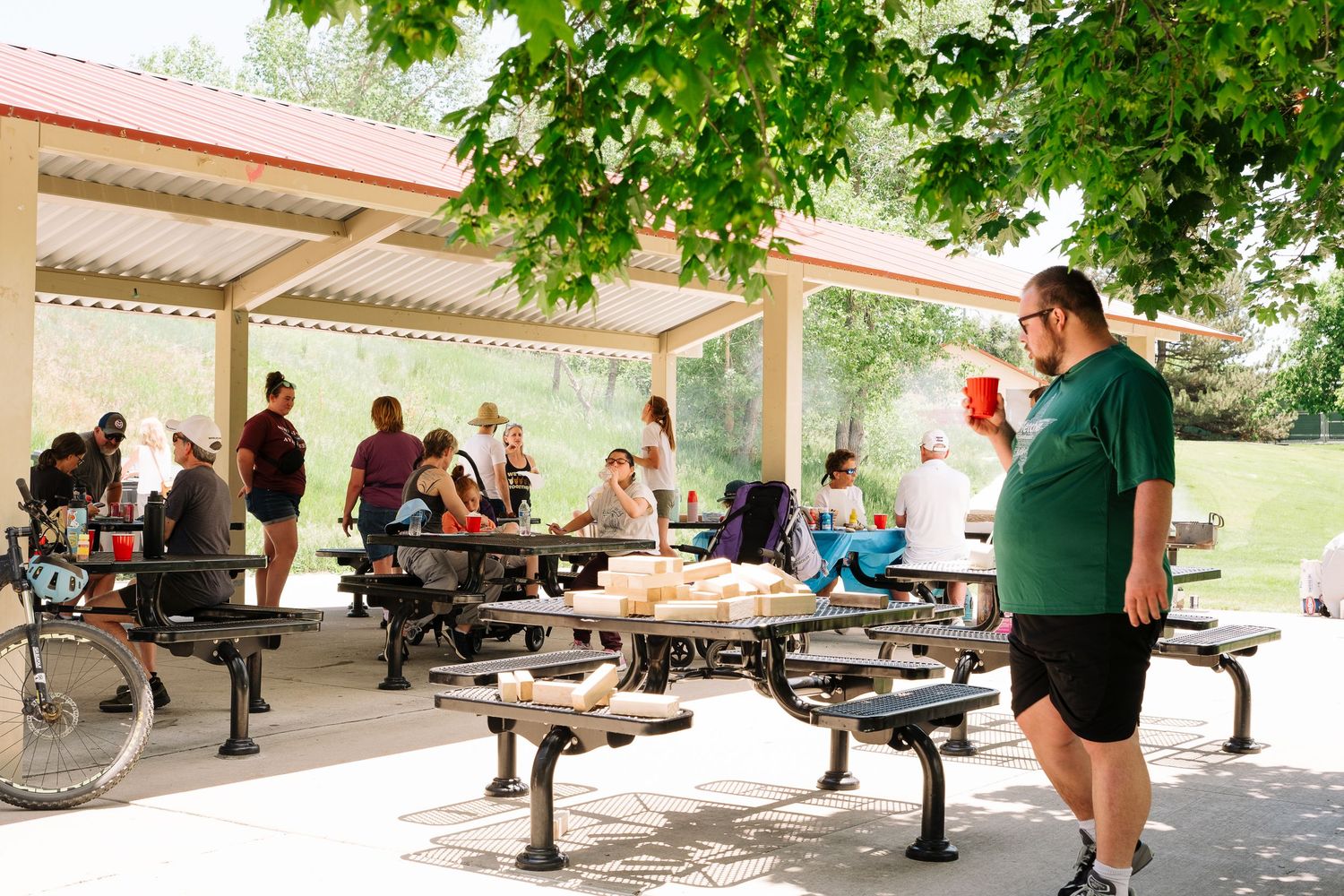 Families commingling at Summer BBQ with Wilderness Inclusion for Learning and Development, Littleton nonprofit.