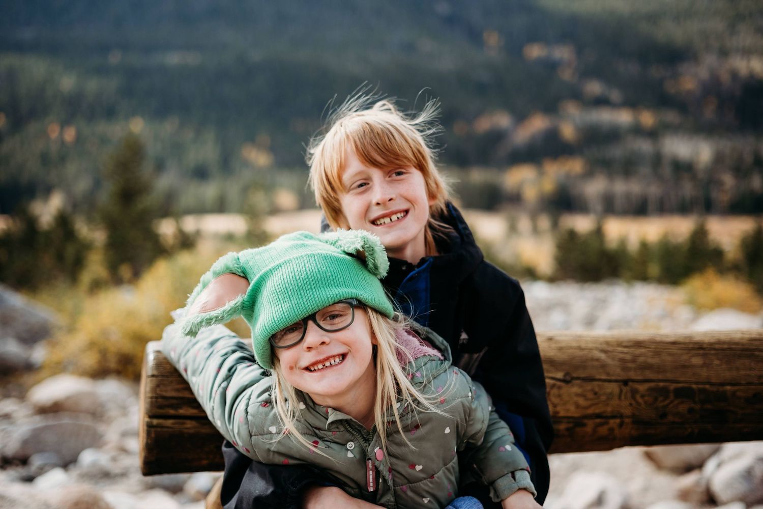 Brother and sister hugging at Rocky Mountain National Park.