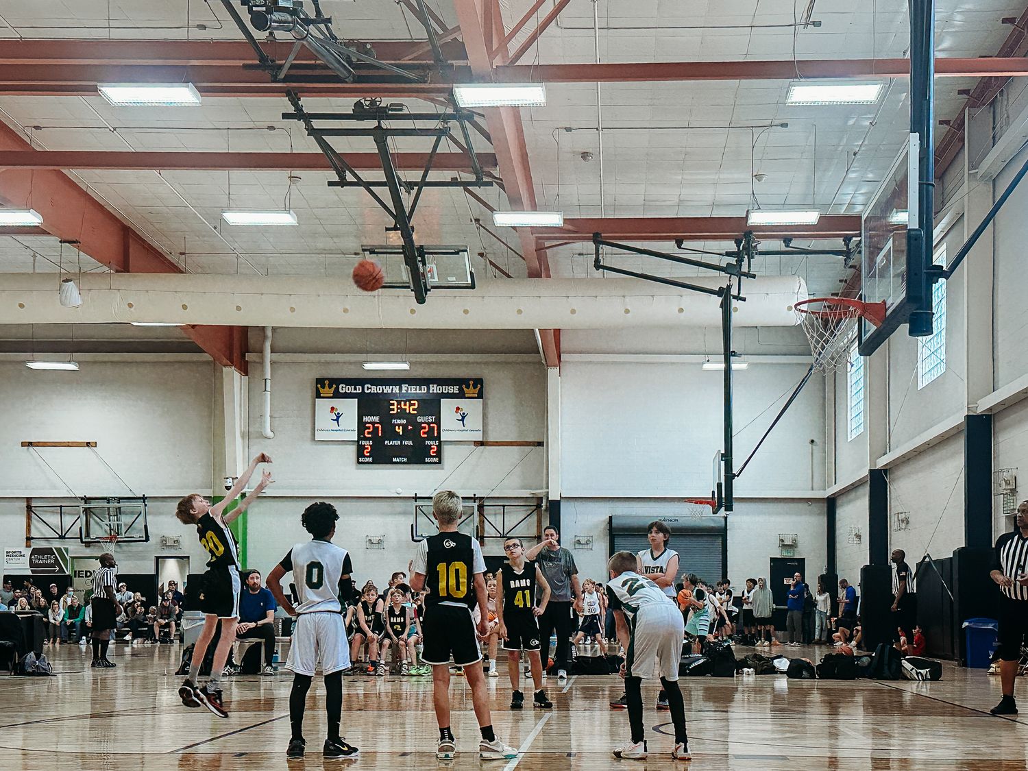 Youth basketball team game, player throwing free throw shot.