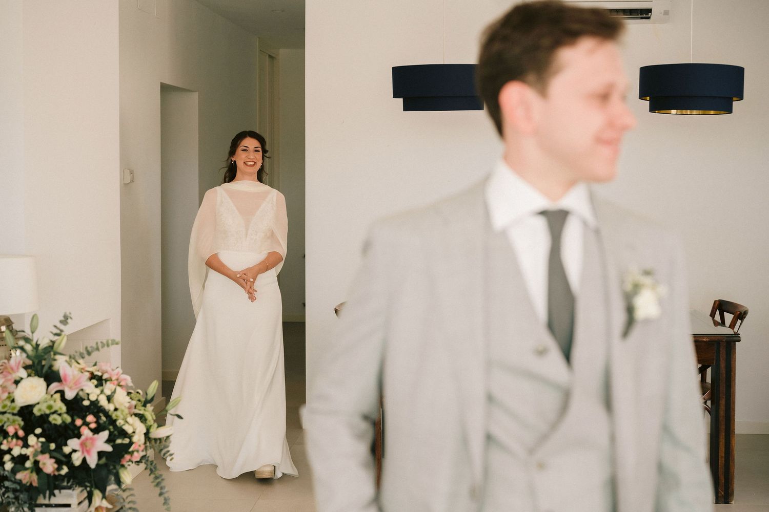 A collection of wedding photos showing moments of preparation, ceremony and celebration in a soft neutral color palette.