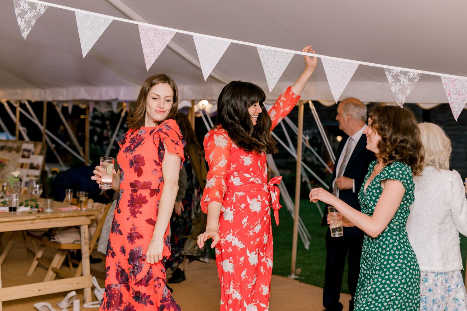Candid wedding photography of guests enjoying dance floor at evening wedding reception in London