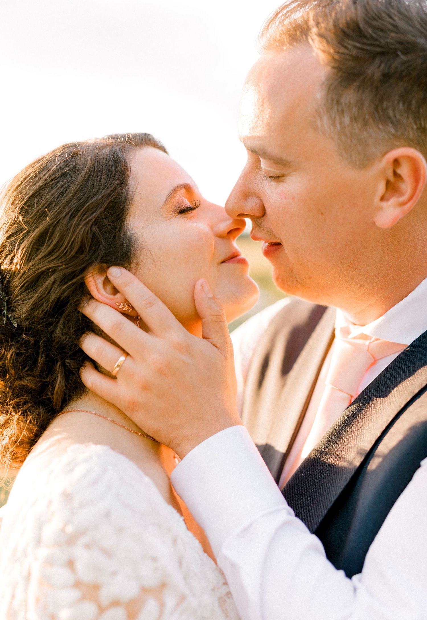 Romantic bride and groom professional wedding photography almost kissing golden hour in venue in London