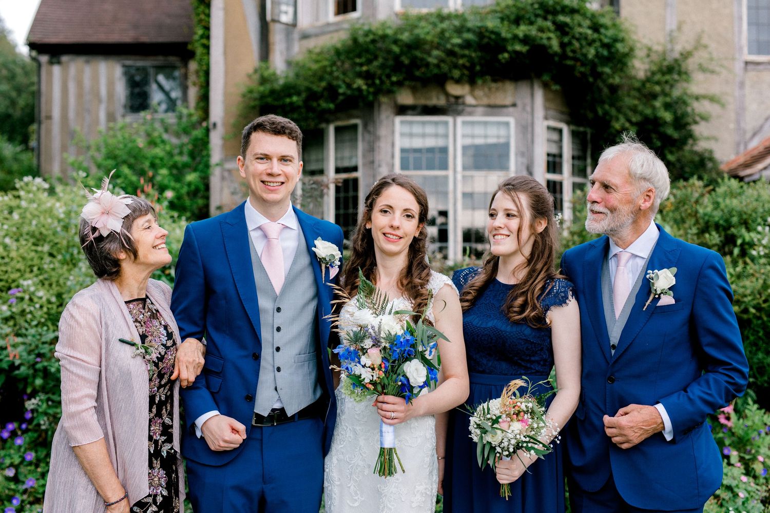 Wedding group portrait of bride, groom and family members at reception venue in Kent