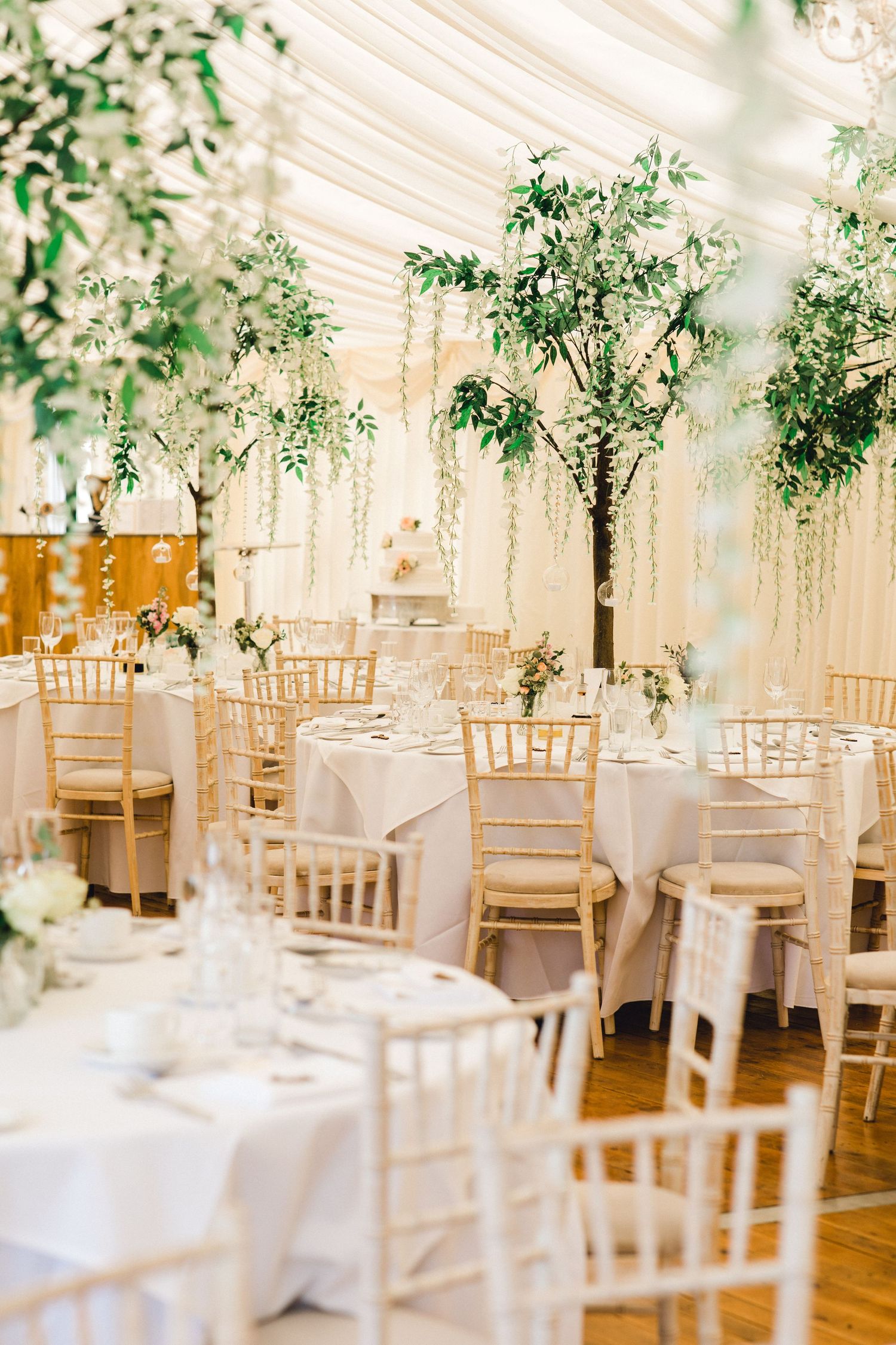 Elegant tablescape with floral centrepieces at Nettlestead Place Maidstone Kent wedding reception