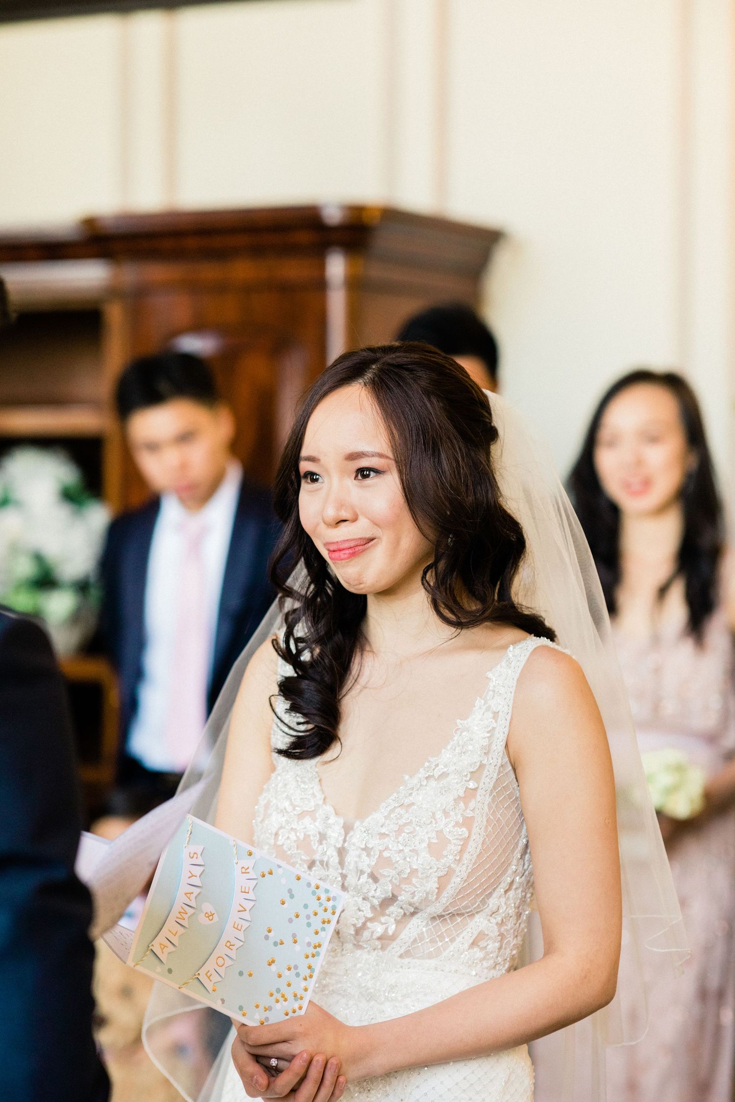Bride and groom exchanging vows, emotional and happy tears Gosfield Hall Essex
