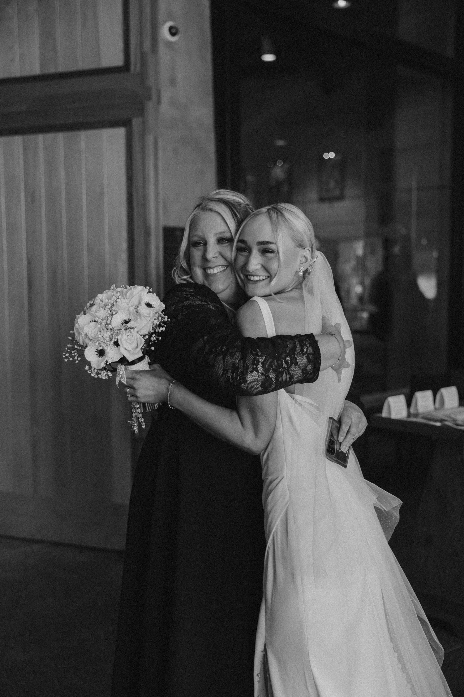 Black and white sequence of tender moments between a couple in formal wedding attire.