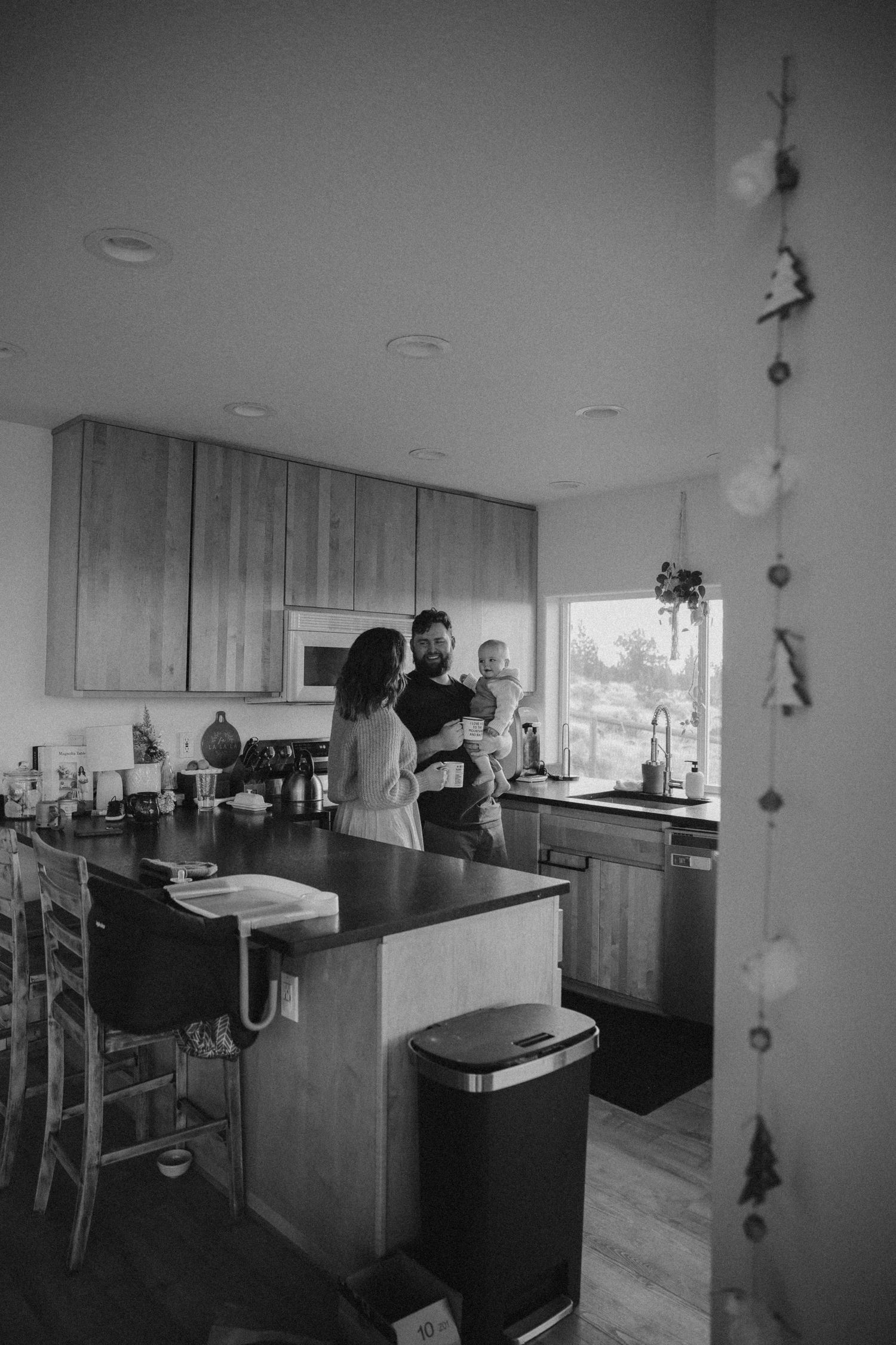 Modern kitchen interior with wooden cabinets and a central island.