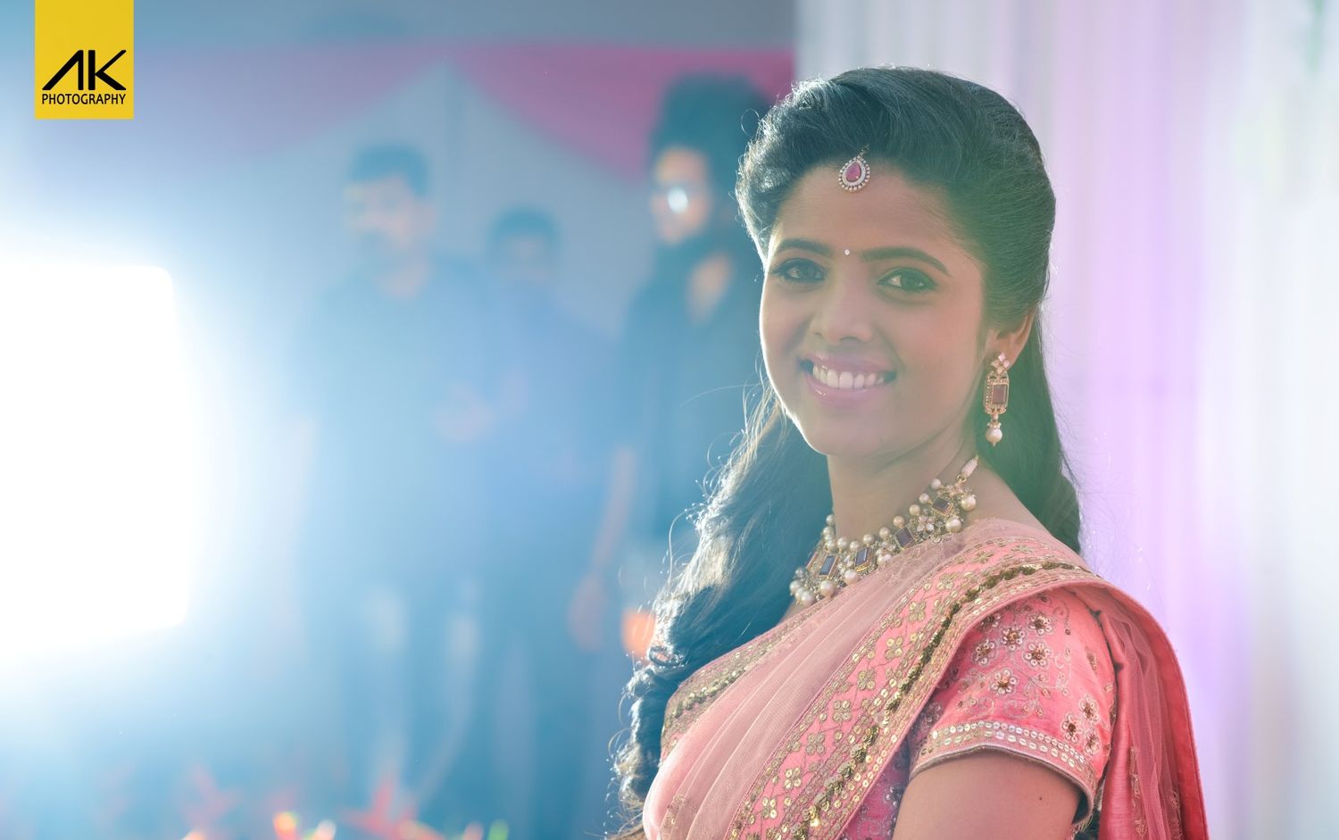 Portrait of someone in traditional Indian attire with soft lighting and bokeh effects.