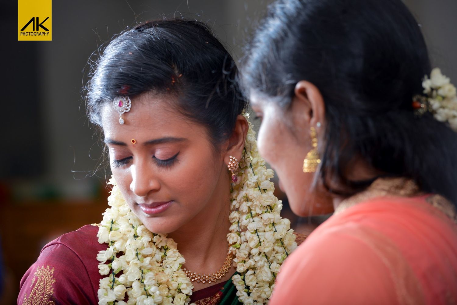 Close-up of traditional South Indian bride wearing jasmine flowers in her hair.